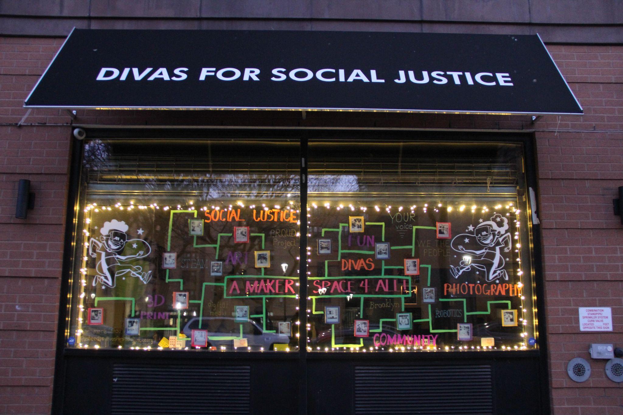 The DIVAS for Social Justice storefront featuring a colorful display about the Maker Space for All project. 